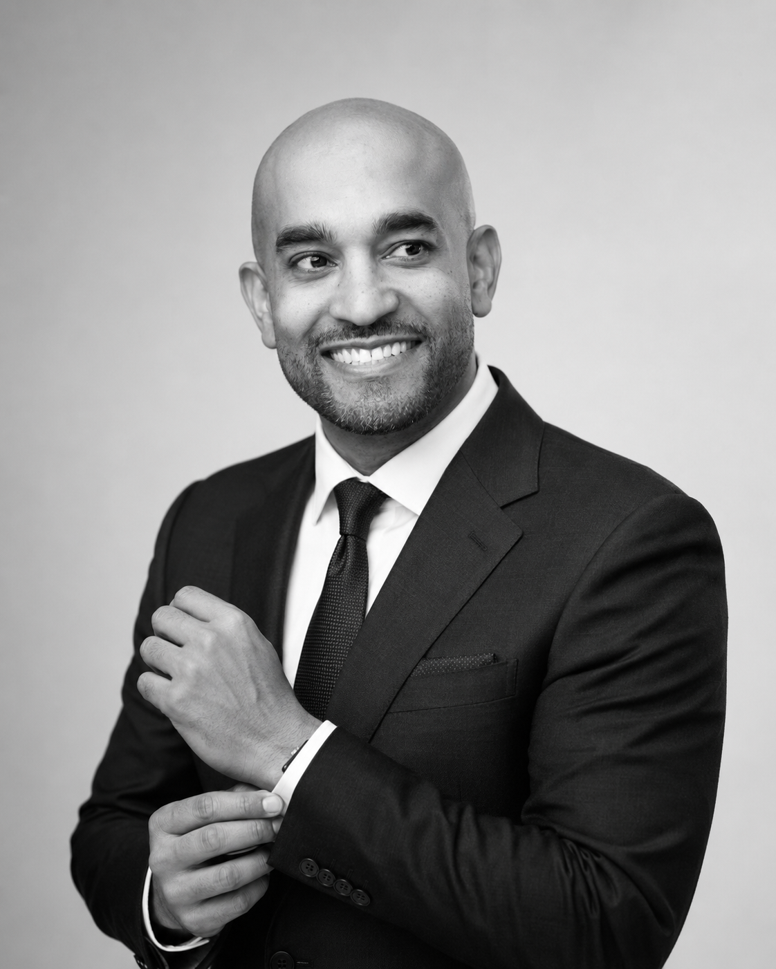 Stephen A. Hart in a black suit and tie